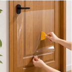 Clear pet scratch protector film applied to wooden door